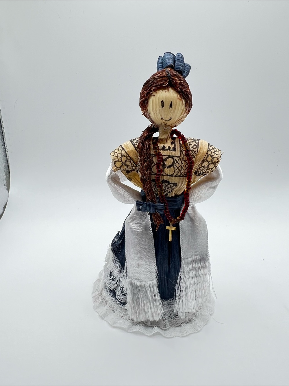 Handmade decorative doll crafted from dried corn husks